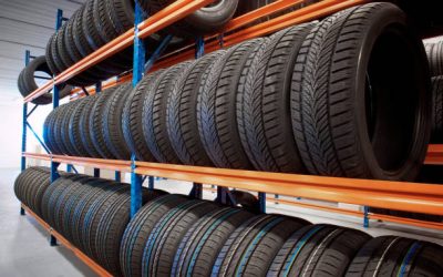 warehouse storing car tyres in rows for sale